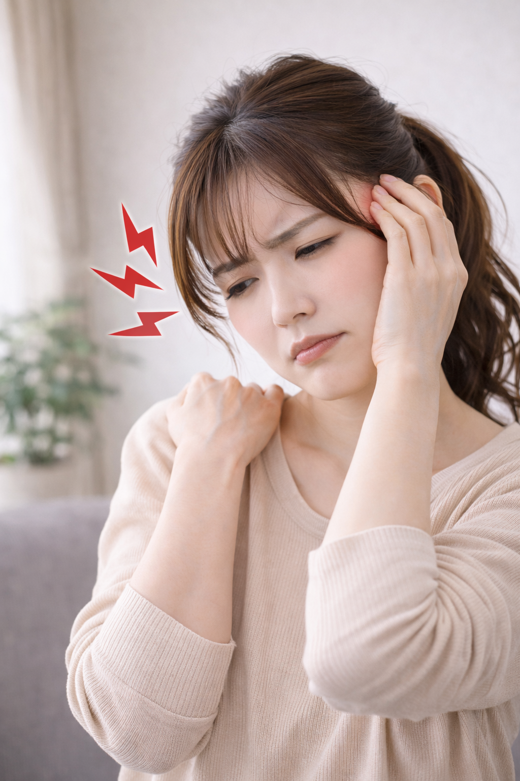 肩こりと頭痛で悩んでいる女性のイメージ