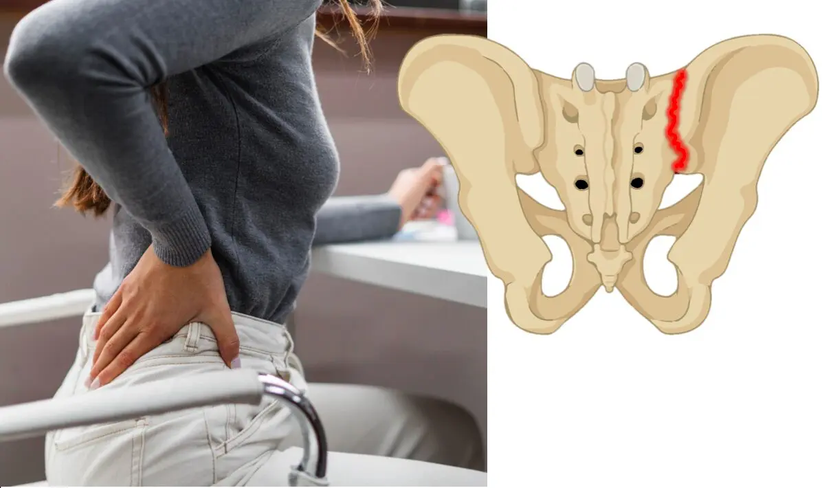 椅子に座って腰が痛い女性の写真です。